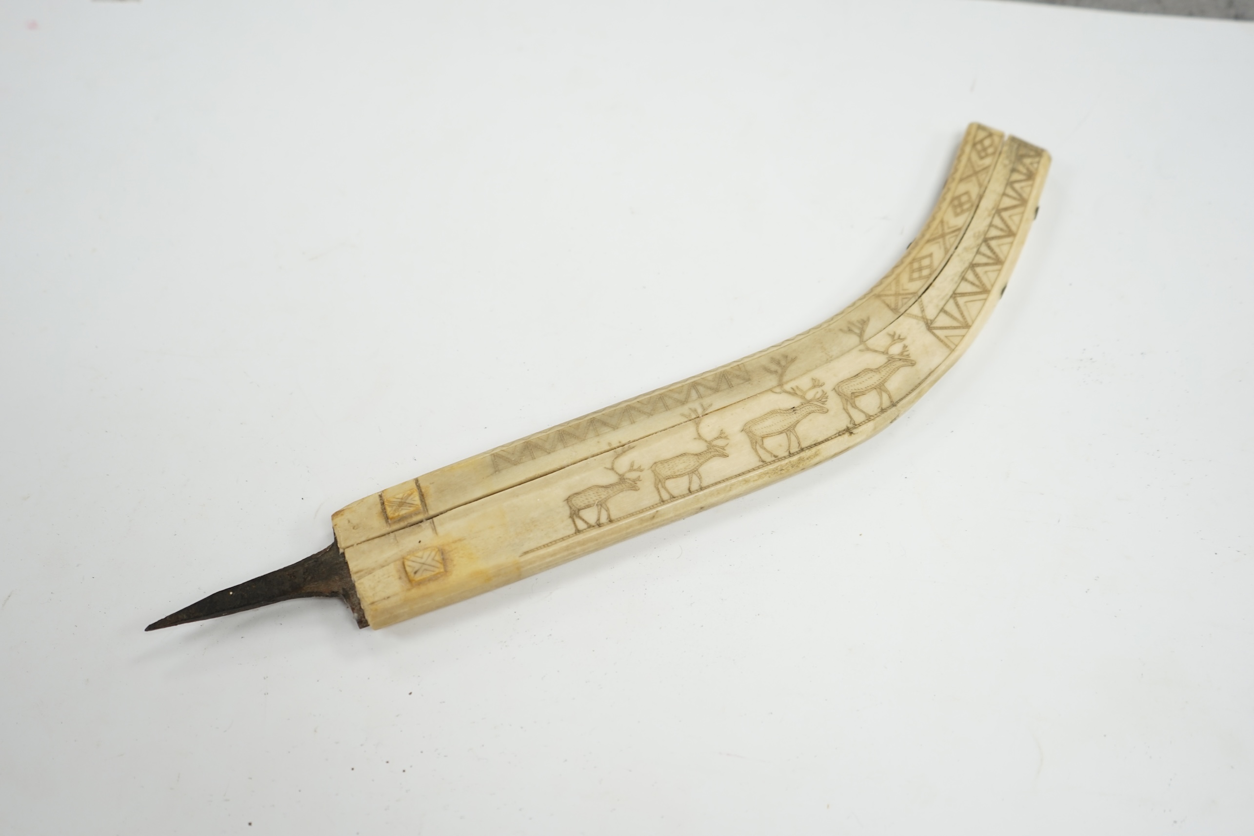 An Inuit? decorated bone blade sheath, 26cm in length. Condition - poor to fair